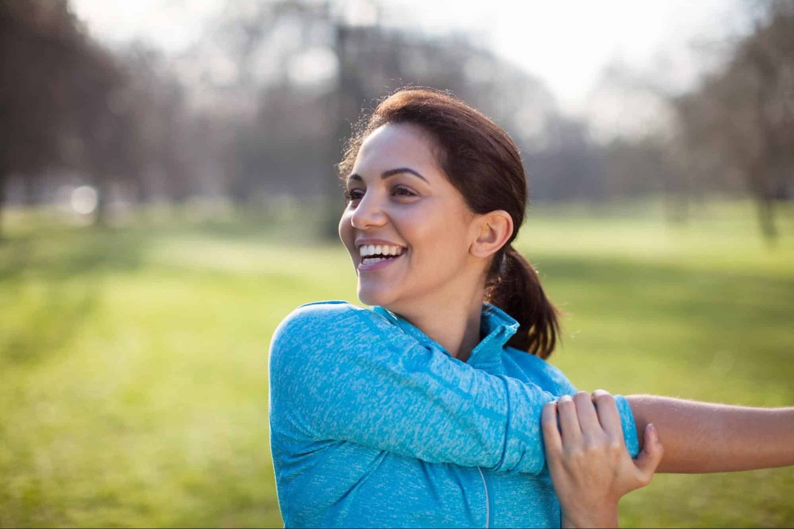 woman stretching, representing the need for adult primary care in Weslaco, TX