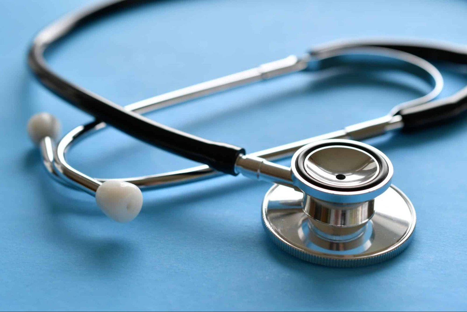  stethoscope on a blue surface, representing a primary care clinic in Weslaco, TX