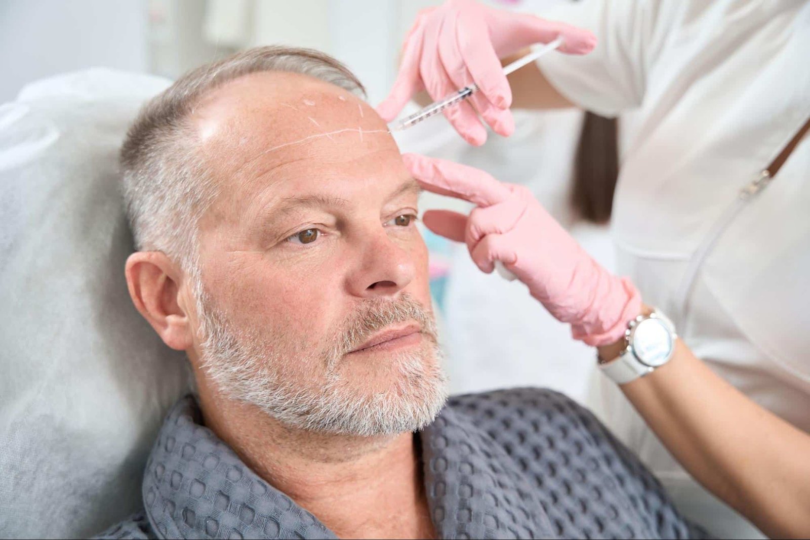 man receiving facial injection