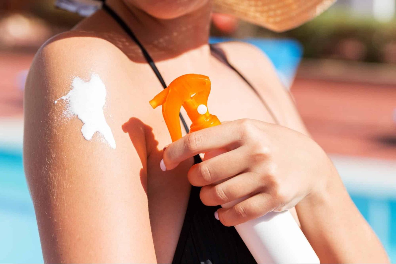 woman applying sunscreen