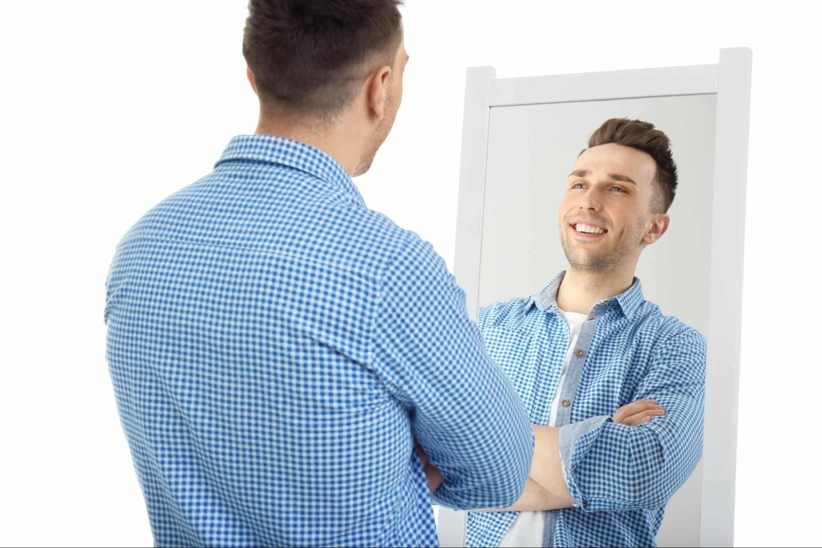 man looking at himself in a mirror