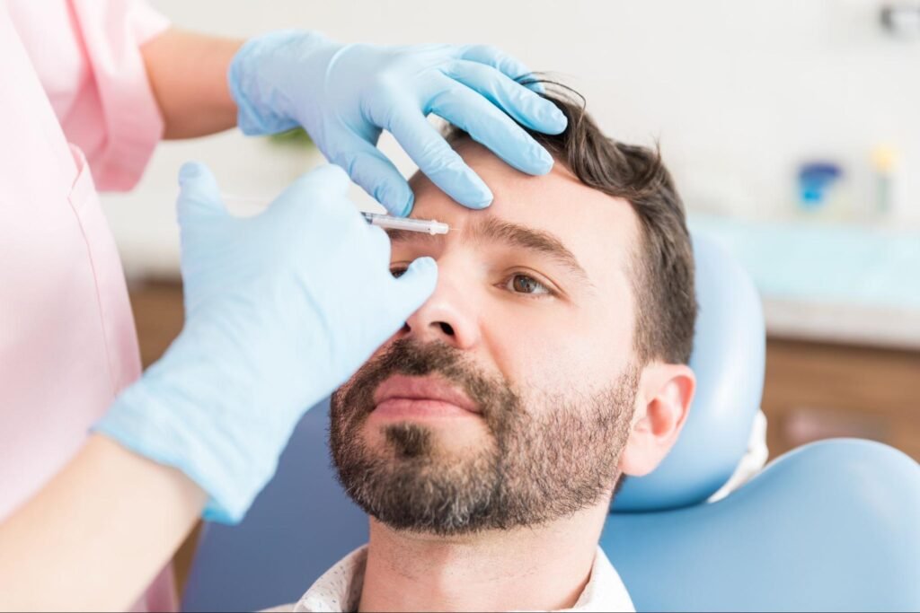 man receiving an injection on the face, representing the work of a licensed aesthetic provider in Weslaco, TX