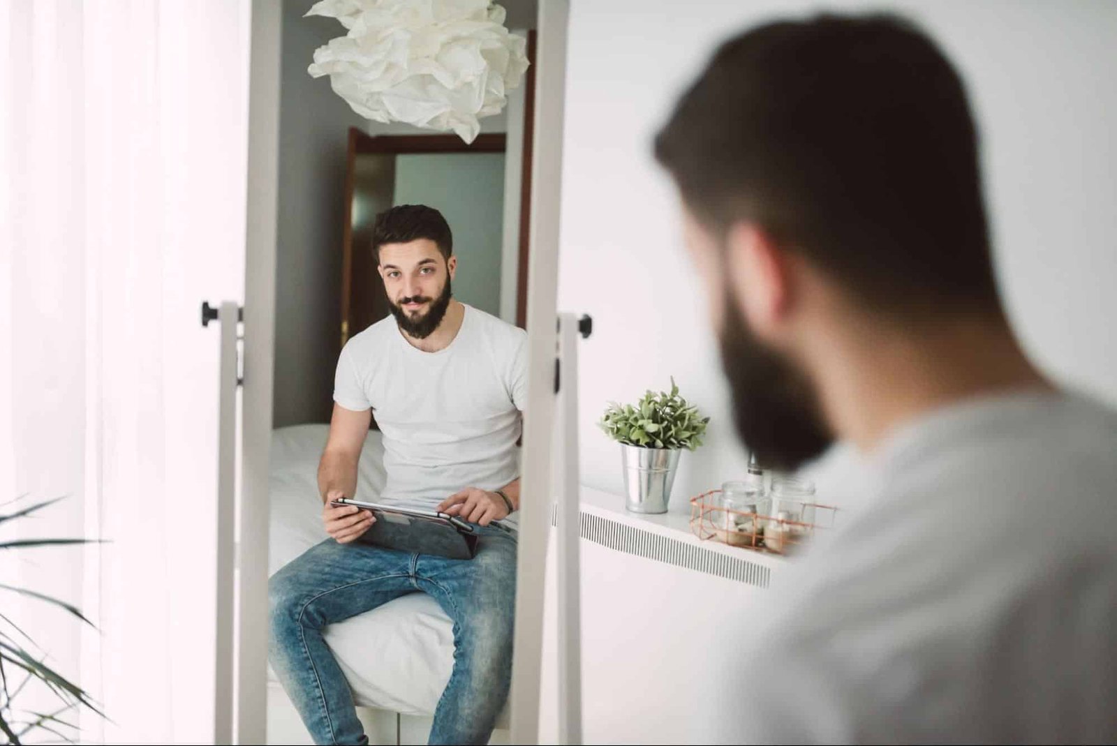 man looking at his reflection