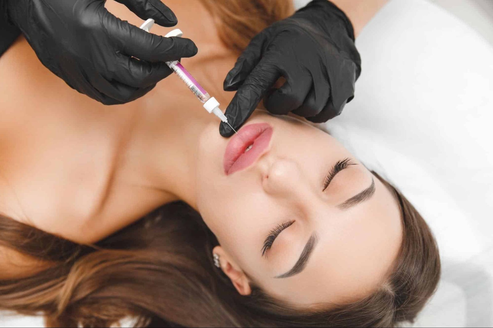woman receiving lip injection