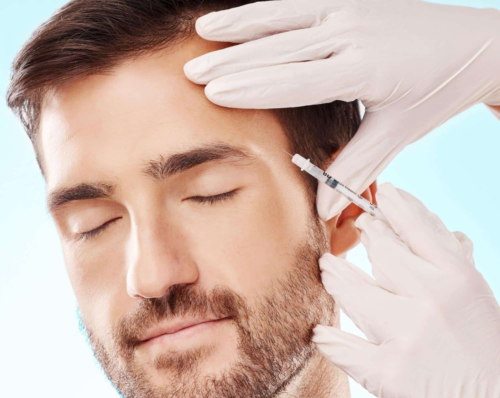 man receiving a facial injection for skin rejuvenation
