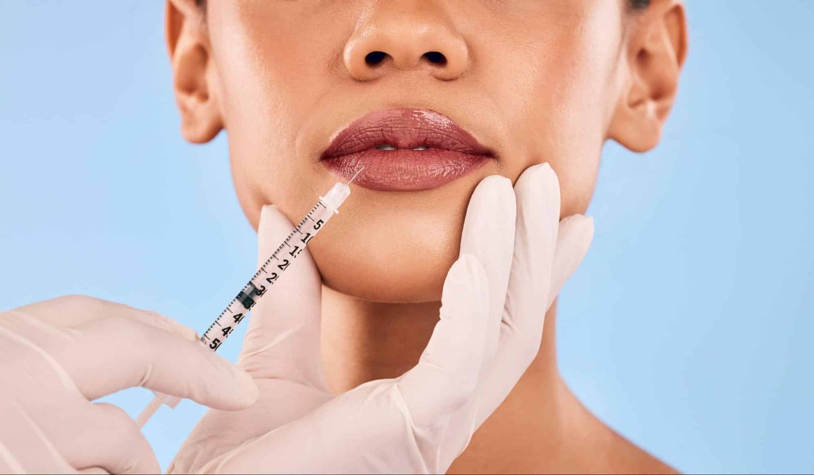 woman receiving lip injection
