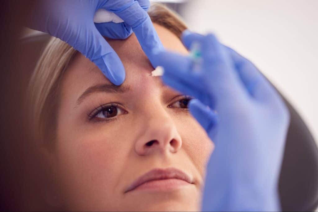 woman receiving facial injection similar to the service provided by a Botox clinic in Weslaco, TX
