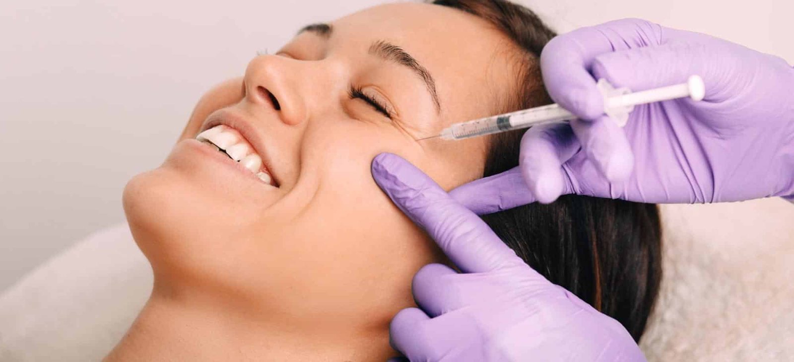 woman receiving facial injection for rejuvenation