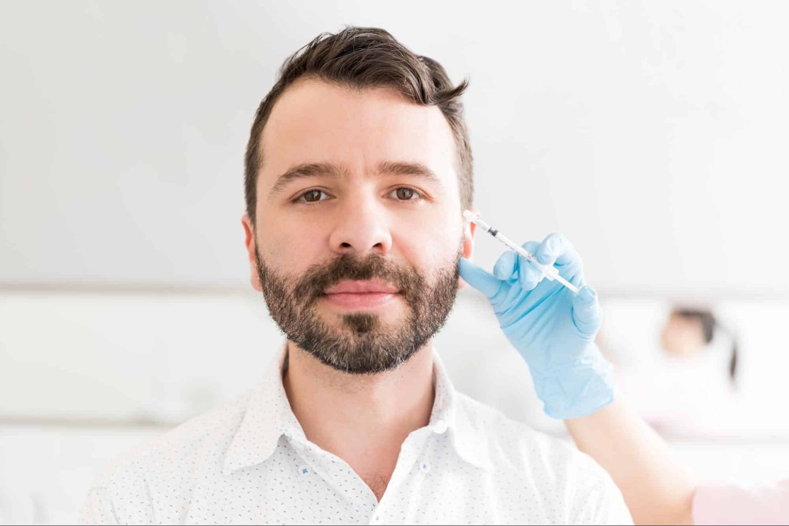 man receiving facial injection
