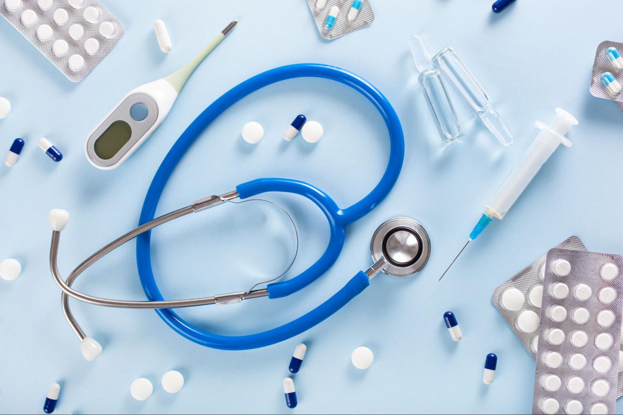 Medical tools including stethoscope, thermometer, pills, and syringe representing care available at an after hours clinic near me open now 