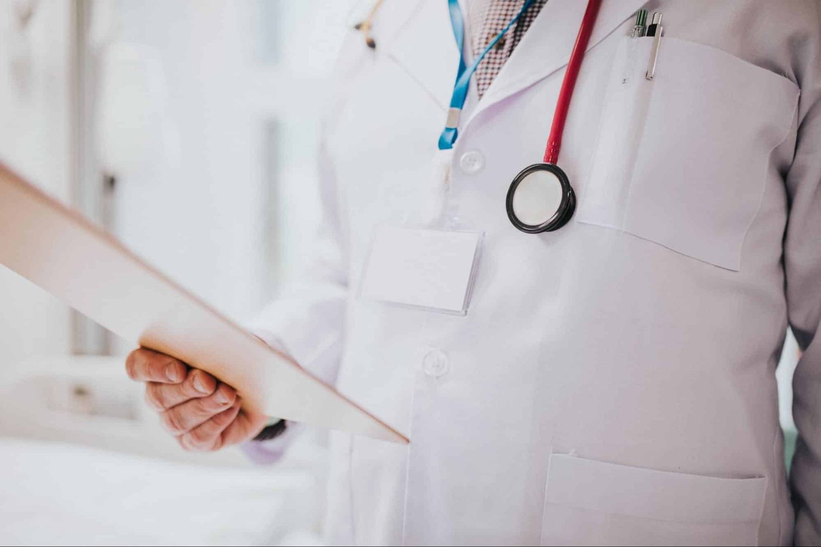 primary care provider reading medical chart