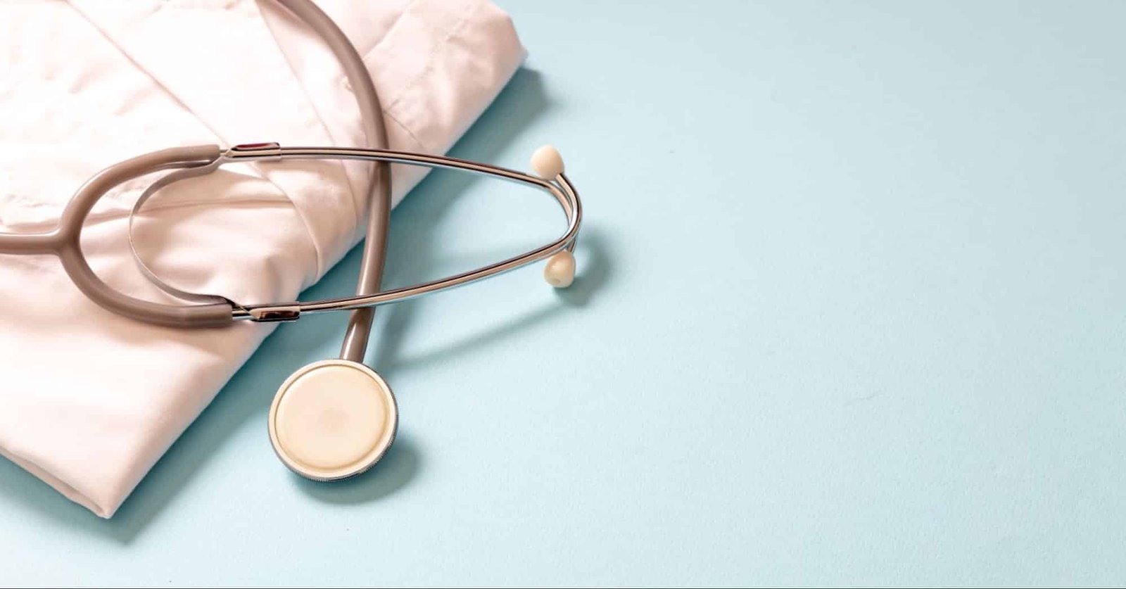 stethoscope and lab gown, representing wellness check in Weslaco, TX