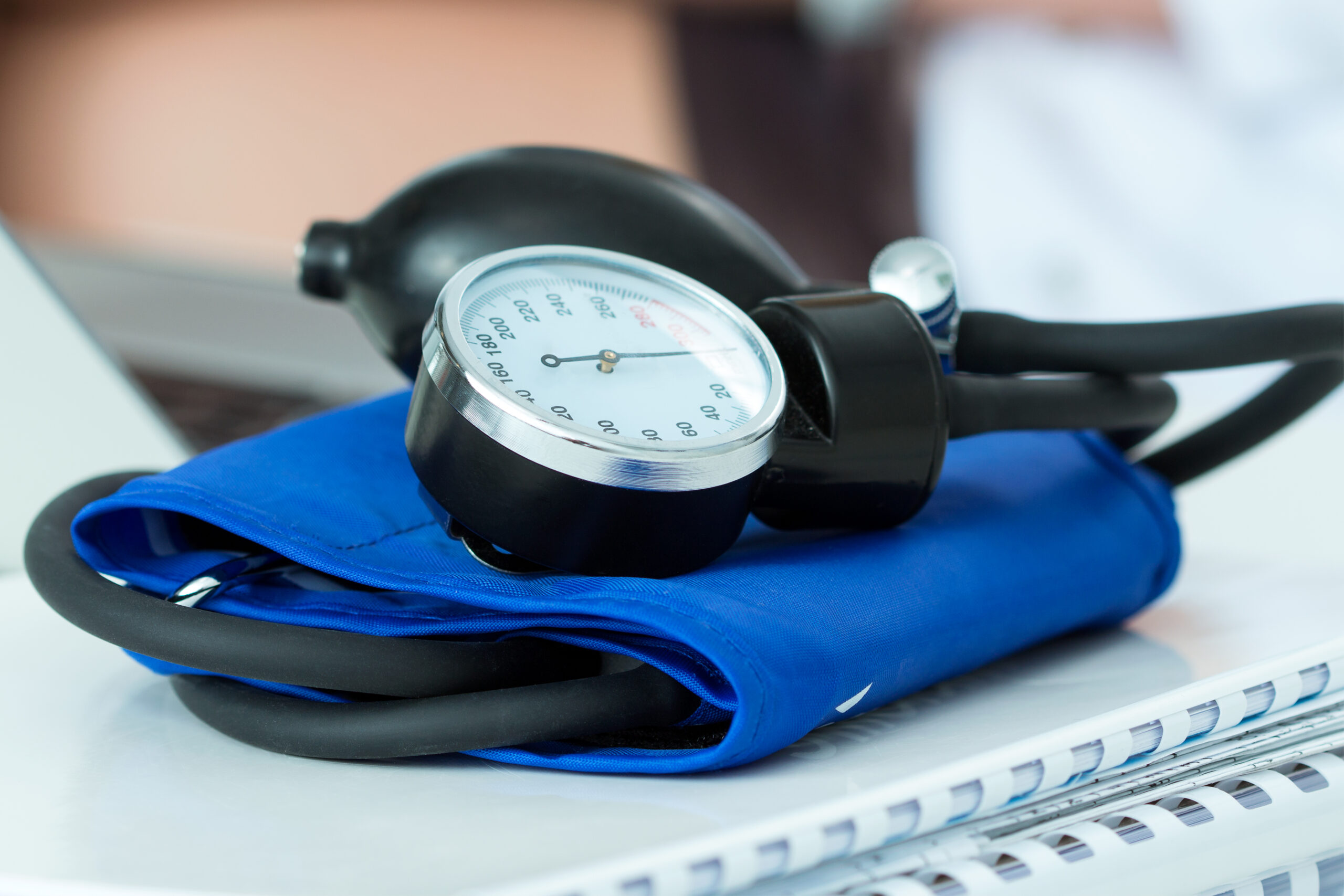 Blood pressure cuff and gauge on exam table representing screening and monitoring for high blood pressure care Weslaco.