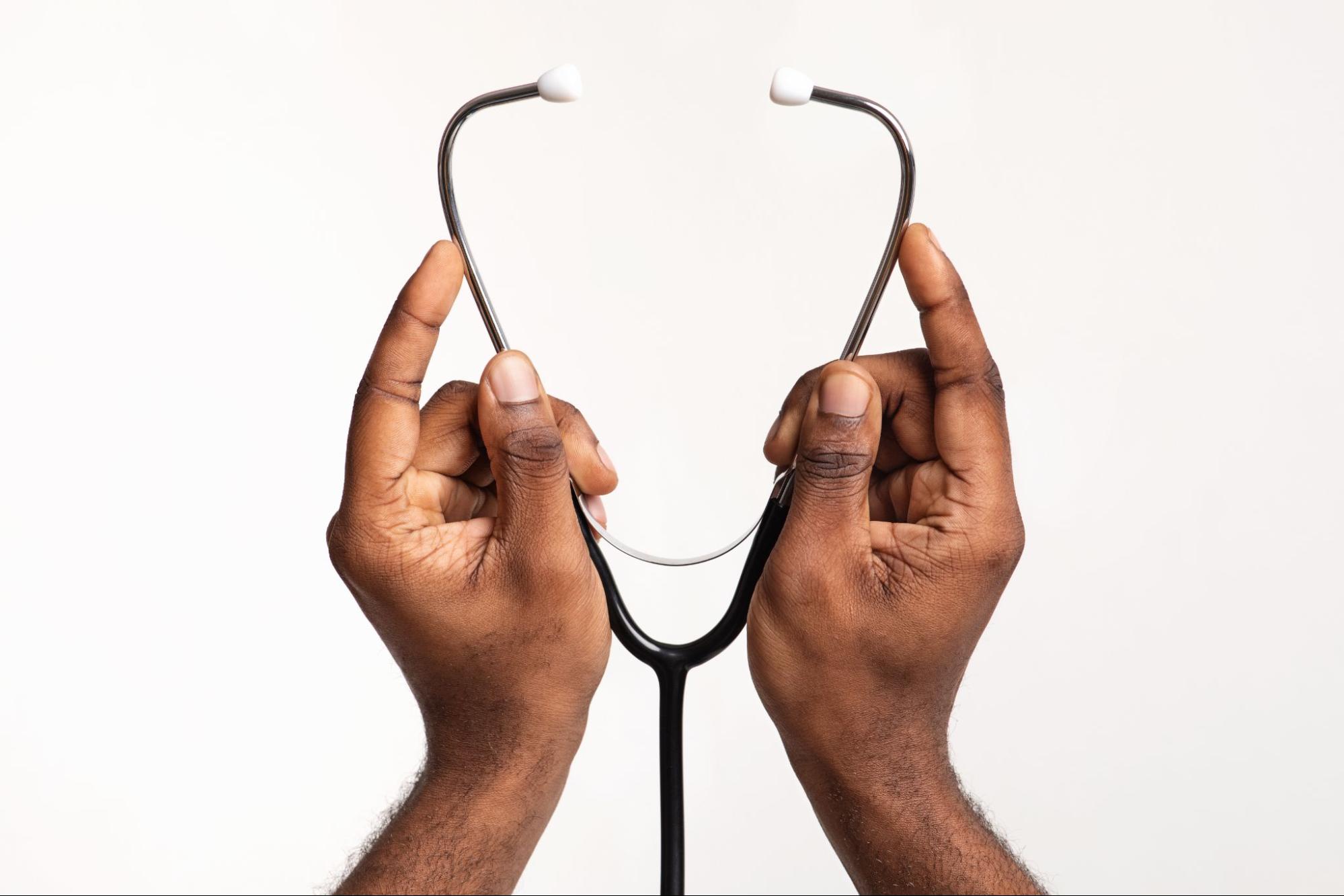 hands holding stethoscope