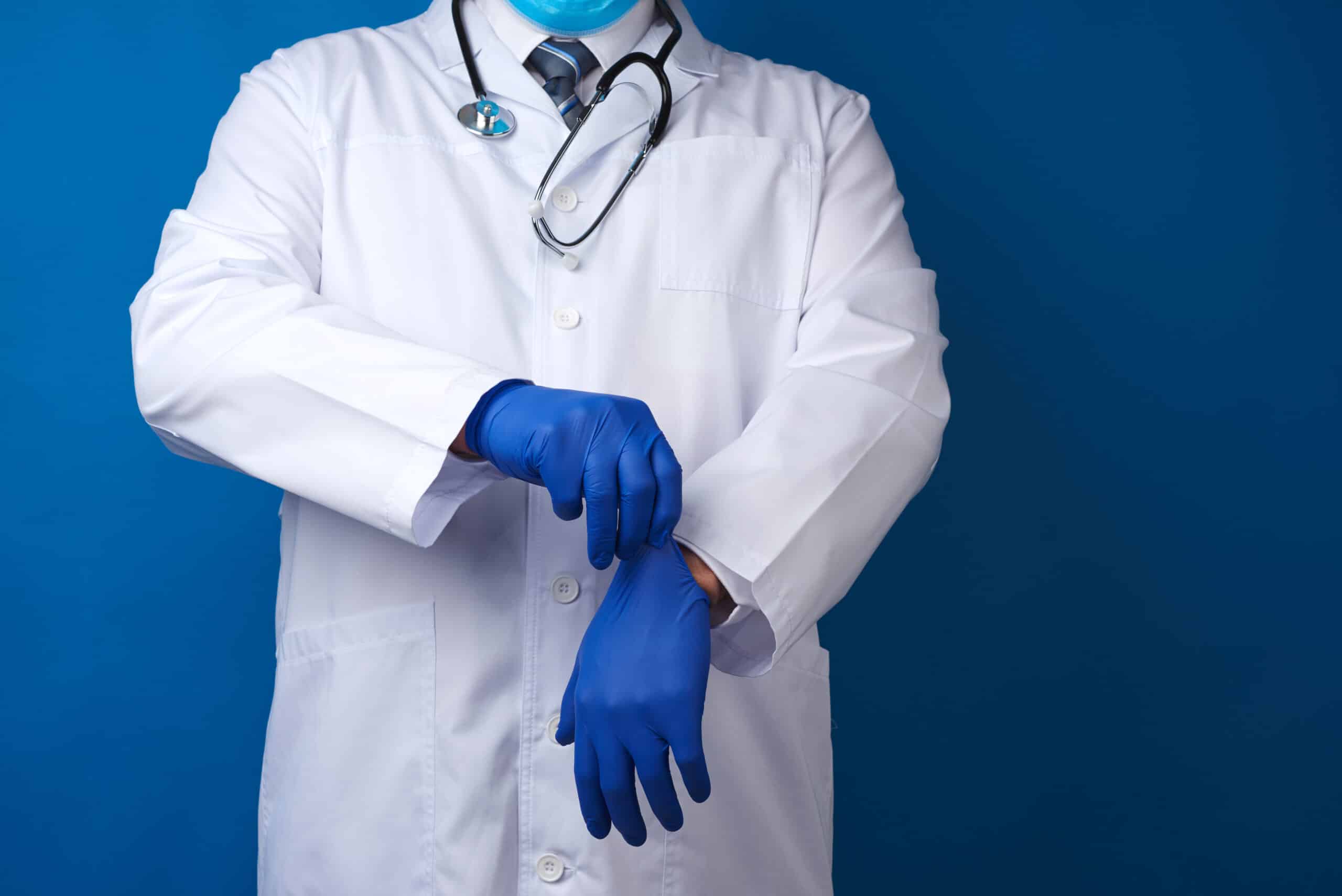 health professional with gloves and stethoscope