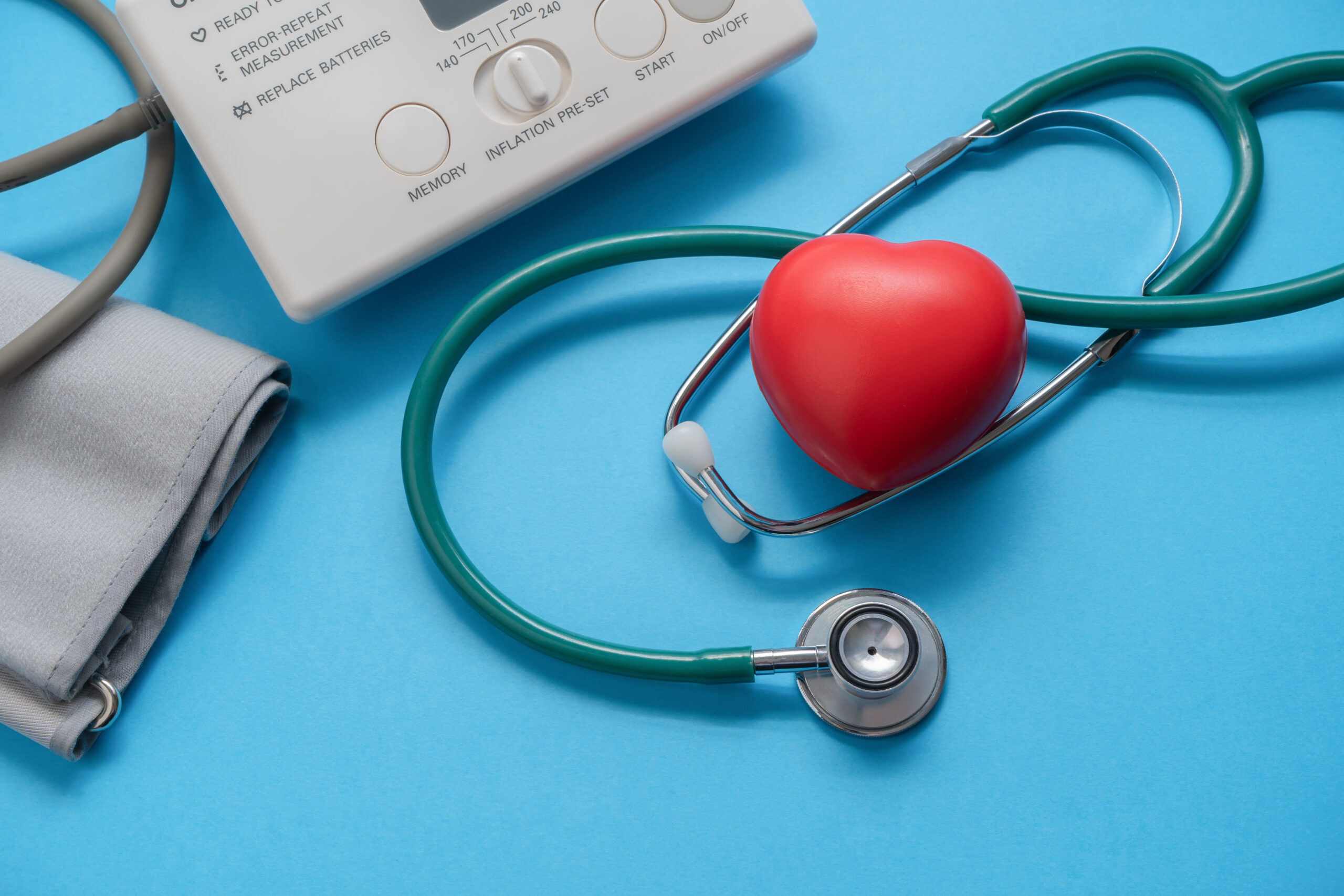 Blood pressure monitor, stethoscope, and heart model representing compassionate primary care in Weslaco TX