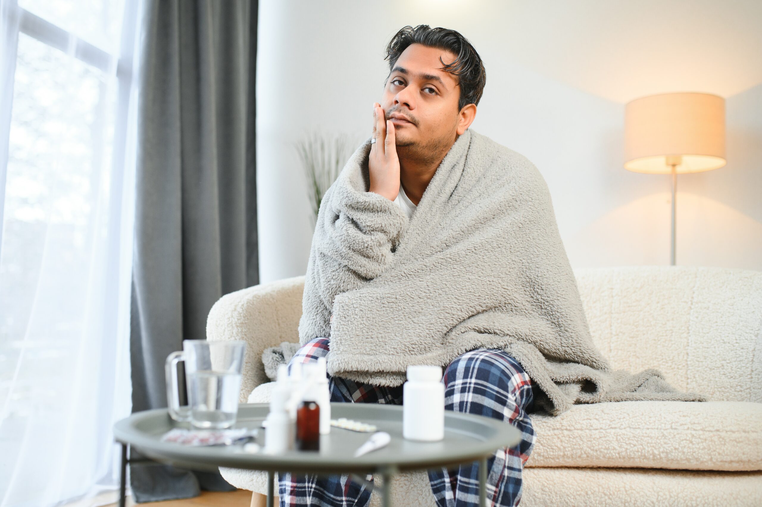 man feeling unwell, representing the need for Minor Illness Clinic After Hours in Weslaco