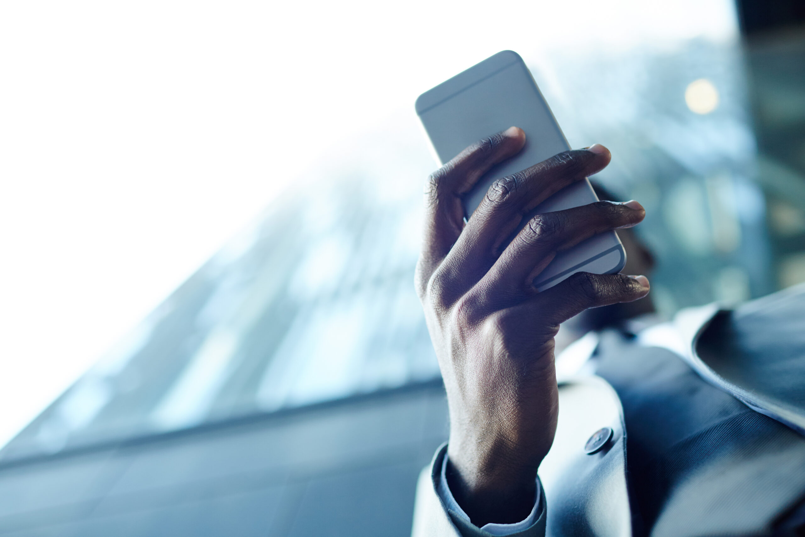 person using phone, representing Weslaco After Hours Clinic Phone Number