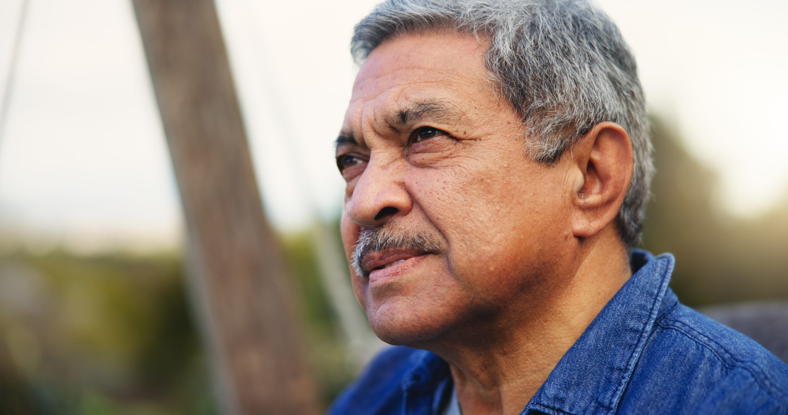 elderly man outdoors, thinking, representing the need for After-Hours Care for Adults in Weslaco, TX