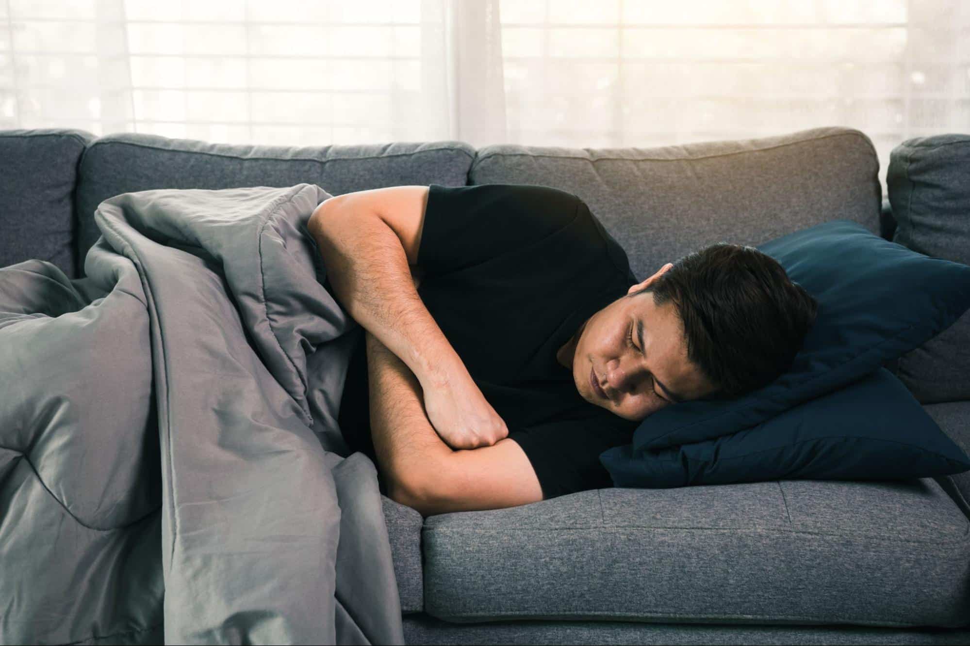 sick man on couch