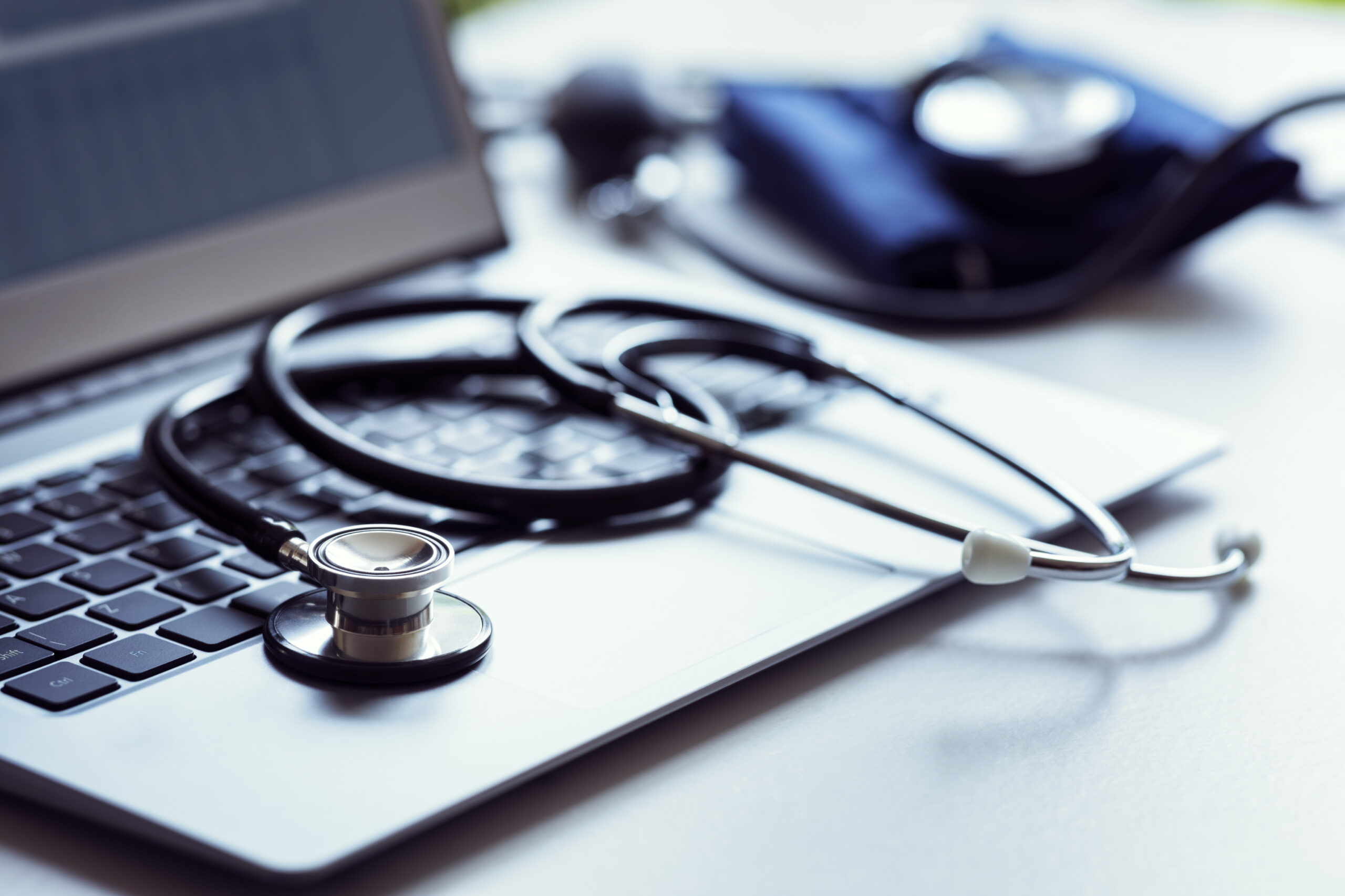 stethoscope on laptop keyboard