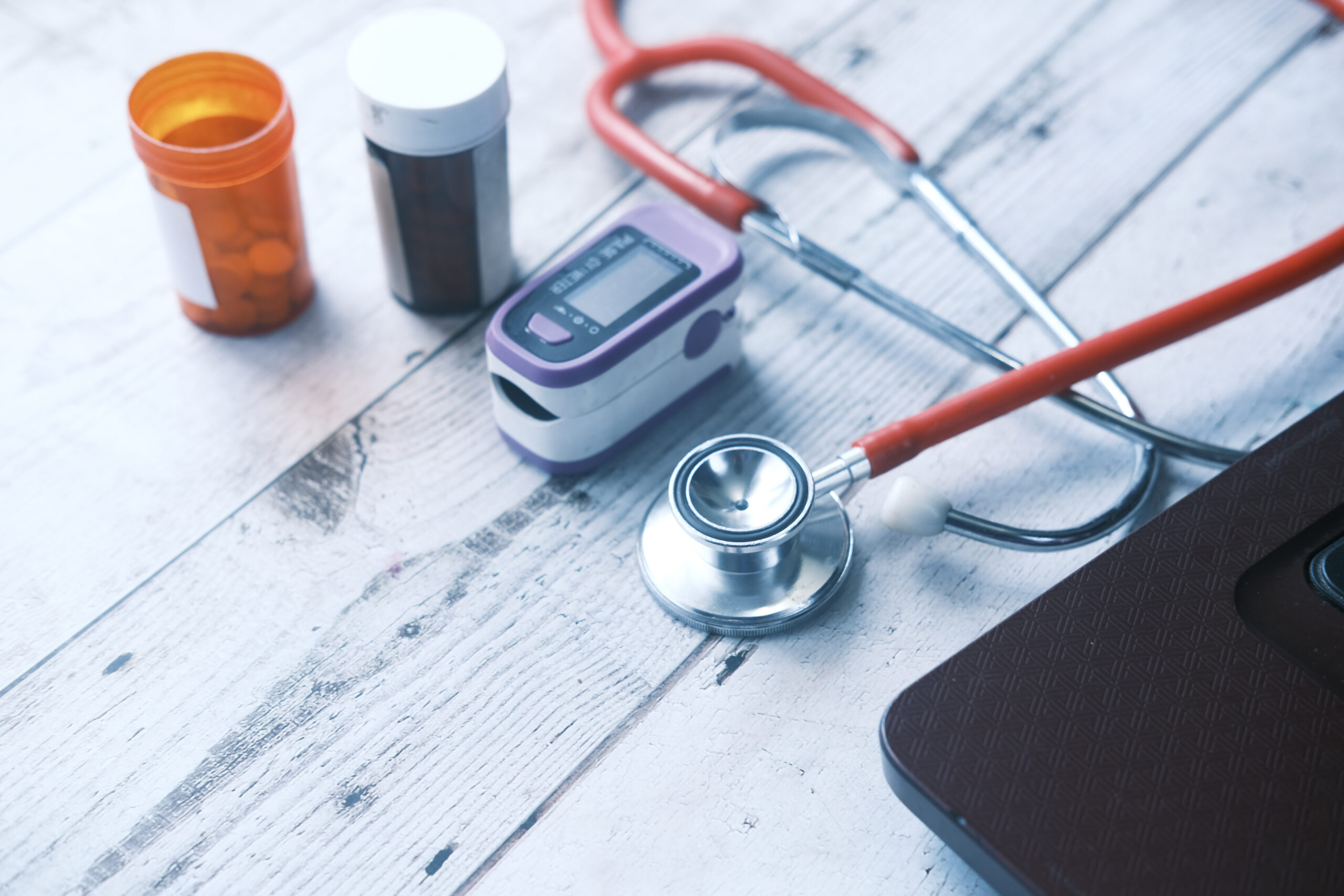 medical tools on a wooden surface